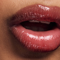 close up of a model lips with peptide lip tint pbj