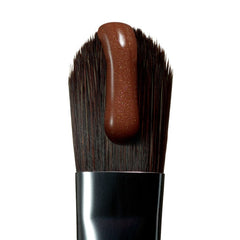 peptide lip tint honey mango on a brush