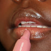 creator wearing peptide lip tint salty tan