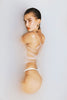 Hailey Bieber soaking in a bath of Glazing Milk