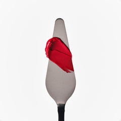 pocket blush candy apple swatch on a spatula