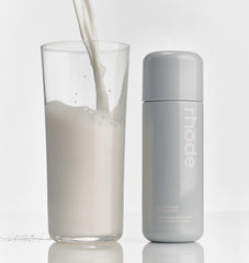 glazing milk next to a glass of milk