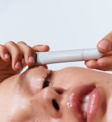 model holding peptide lip treatment