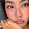 model wearing peptide lip tint in salty tan