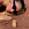 georgina with highlight milk and peptide lip tint honey mango